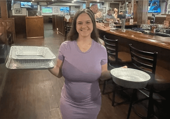 woman holding baking pans