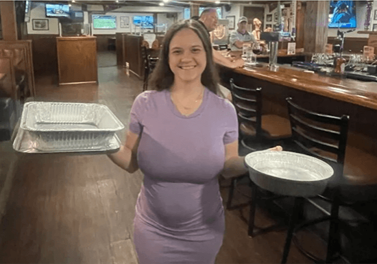 woman holding baking pans